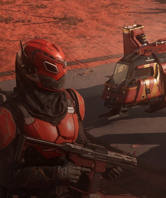 Star Citizen character: Red-armored soldier with a futuristic helmet and weapon standing in a desert environment near a compact spacecraft.