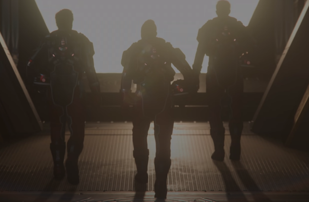 Star Citizen: Silhouettes of three armored figures walking towards a bright light, symbolizing exploration and teamwork.